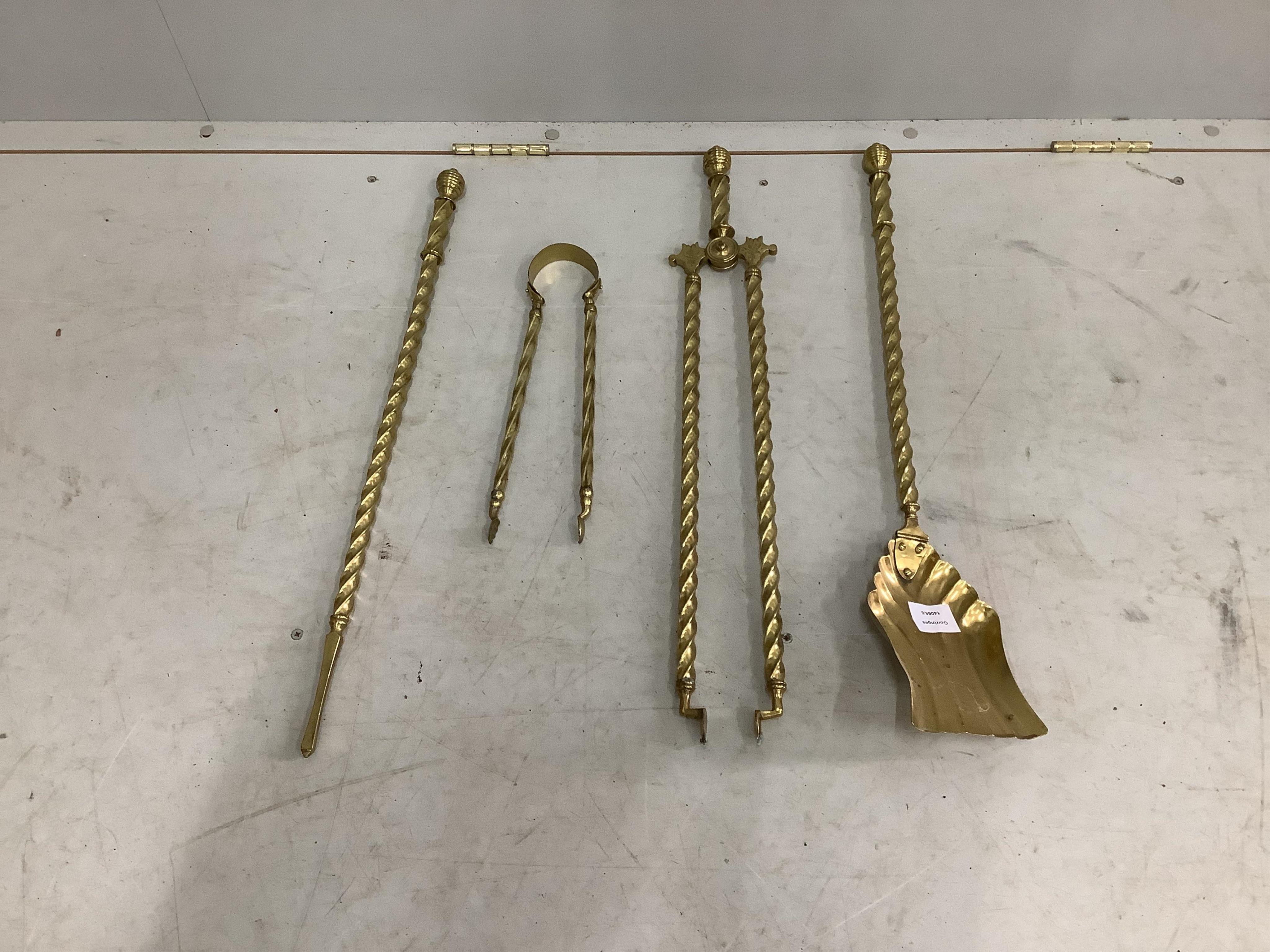 A set of four Victorian brass fire implements